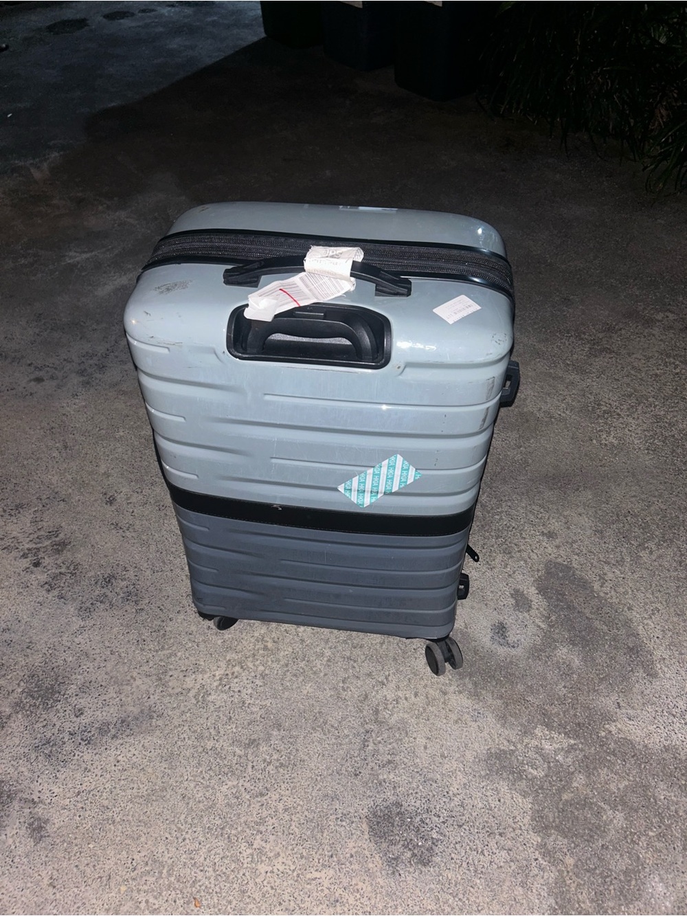 Light Gray Hard-Shell Spinner Suitcase with Carry Handle